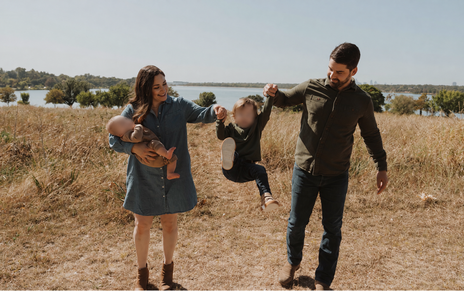 Steve and his wife outdoors with their two sons; both boys’ faces are blurred
